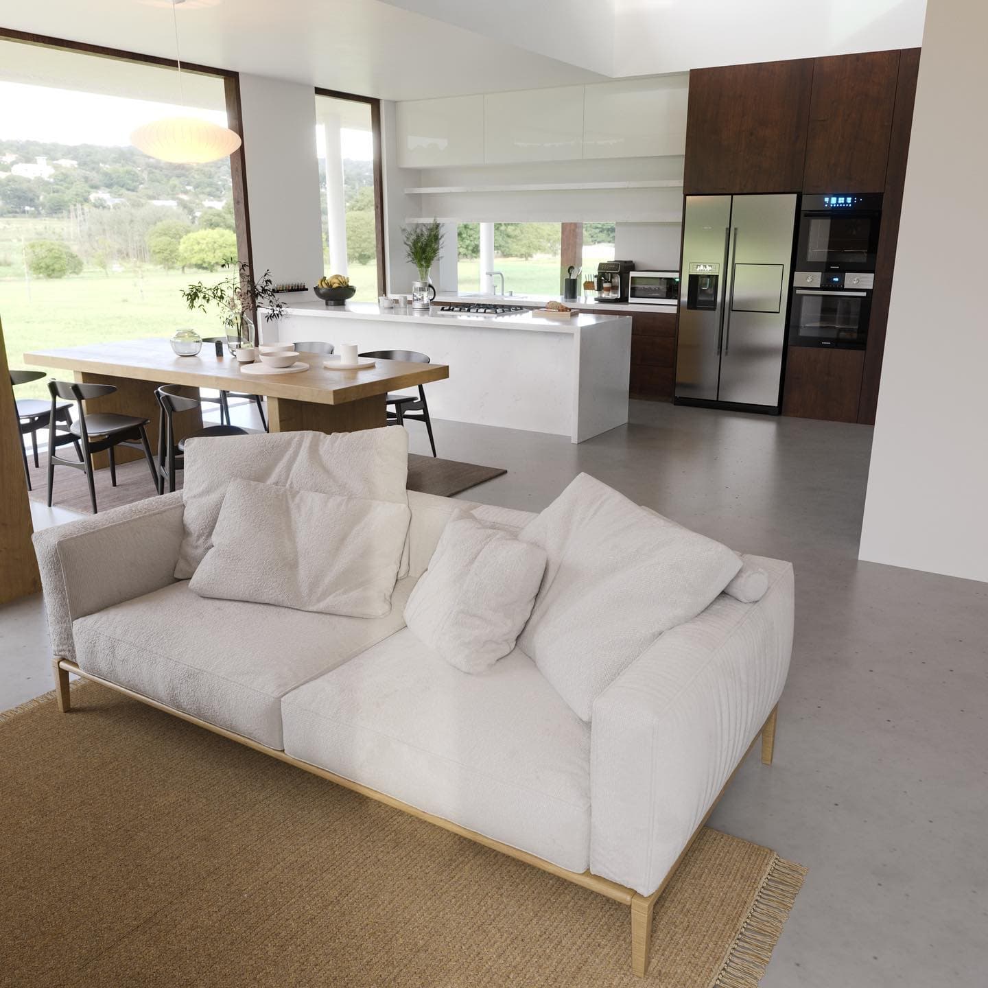 Open-plan living, dining and kitchen with a white island, walnut tall units and full-height windows onto the garden